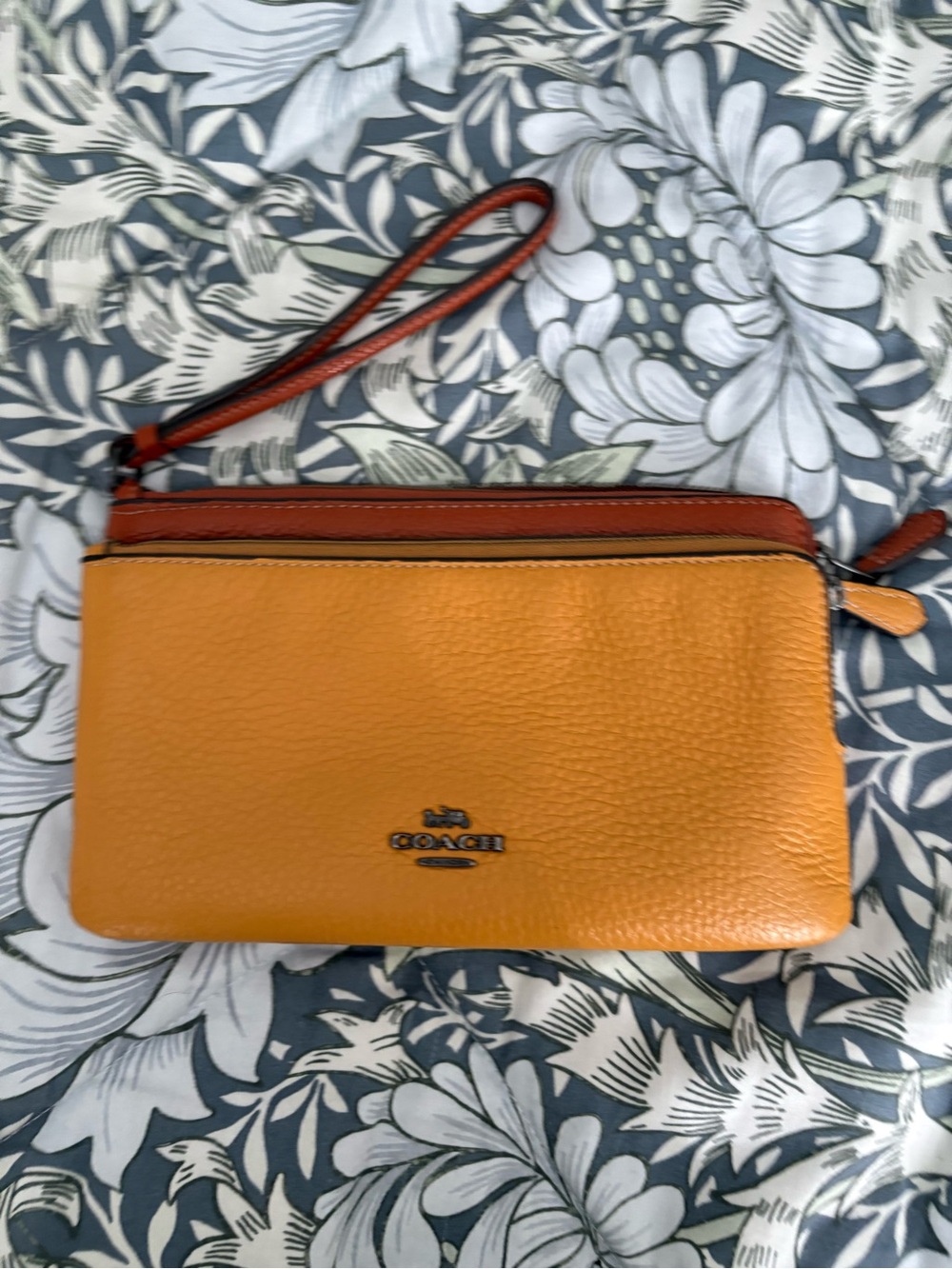 Coach Pebbled Leather Wristlet in Orange with Rust Trim
